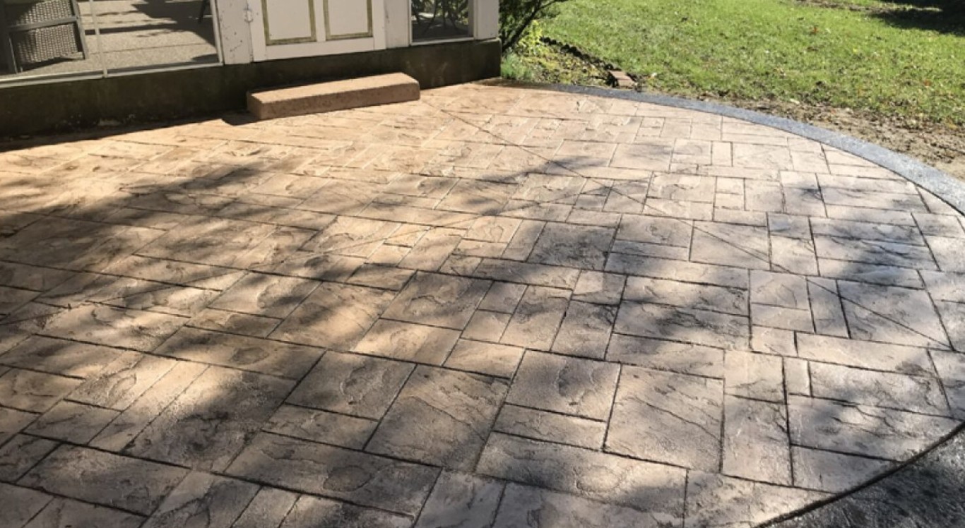 Beautiful stamped concrete patio installation with decorative pattern in Reynoldsburg, OH